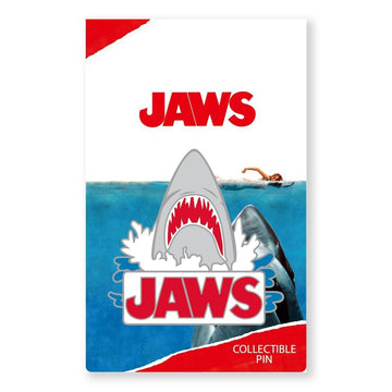 Collectible pin with JAWS logo and shark design on a white background for the JAWS 50th anniversary merchandise at the Academy Museum